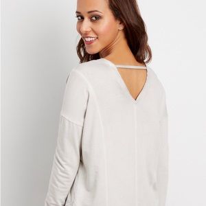 Sweatshirt. Knee high socks. And a bracelet